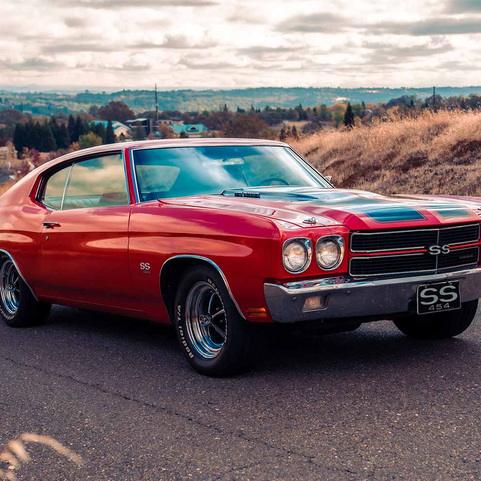 A hero shot of a red chevrolet chevelle